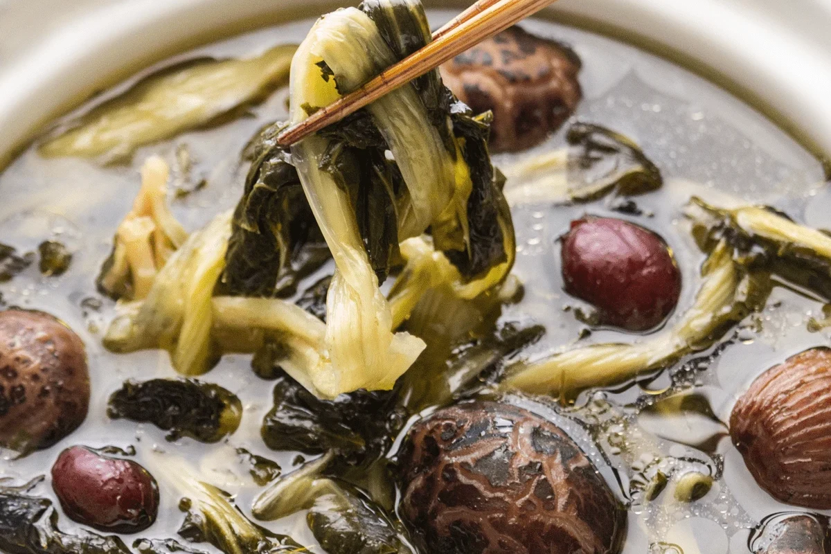 A hearty pot of vegetable soup featuring a mix of colorful rehydrated vegetables in a clear broth.
