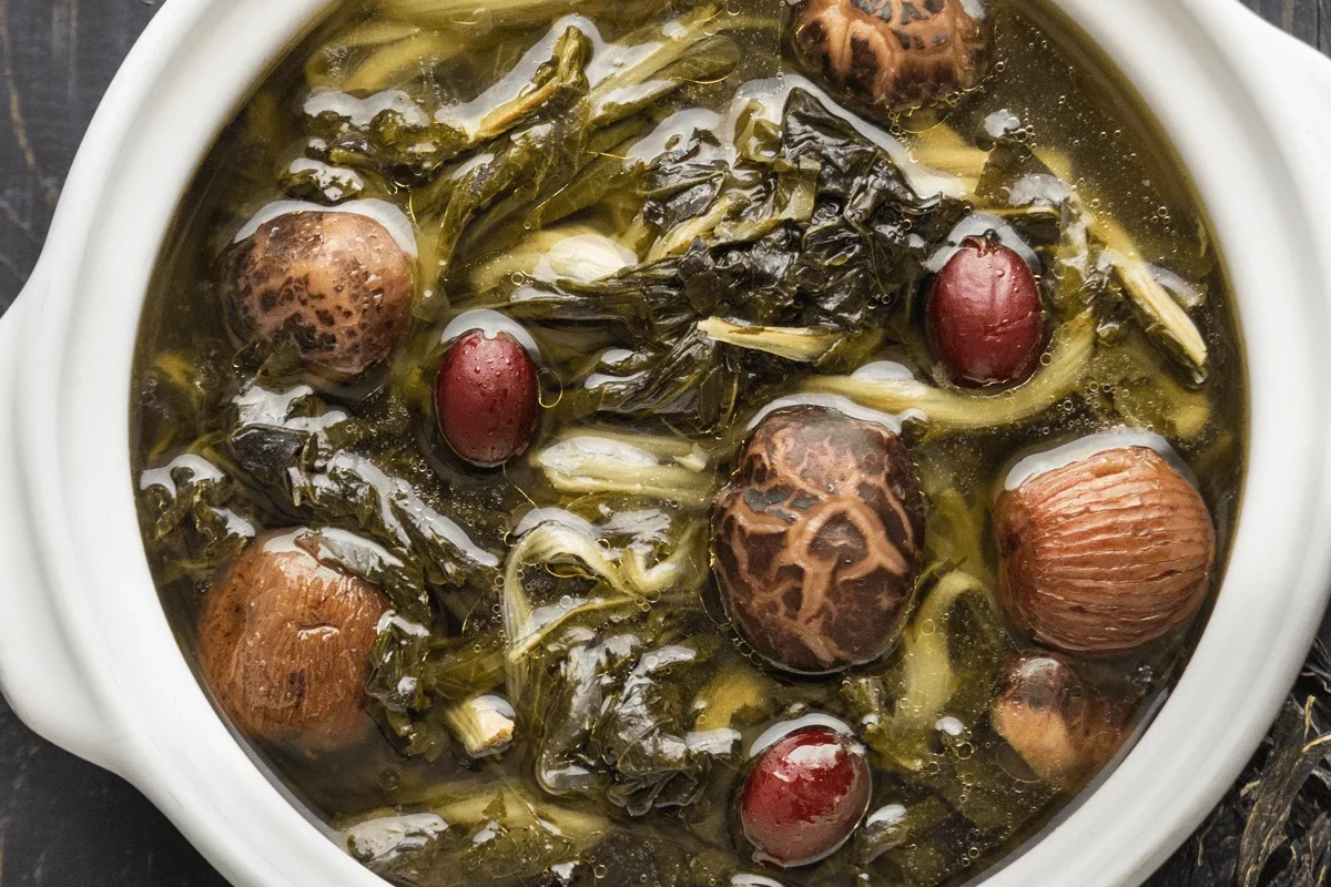 A hearty pot of vegetable soup featuring a mix of colorful rehydrated vegetables in a clear broth.