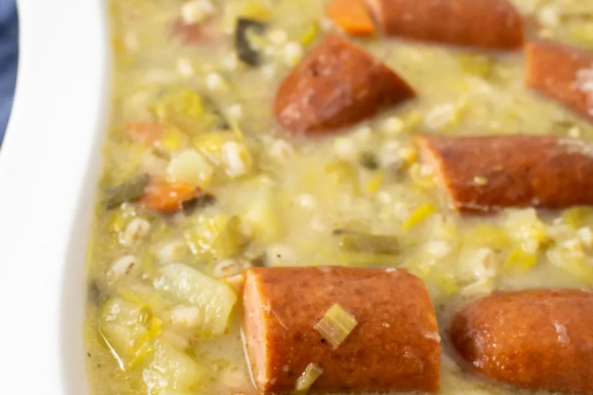 Leek Potato and Sausage Soup Recipe: Creamy, Hearty One-Pot Meal 1 A bowl of creamy leek, potato, and sausage soup garnished with fresh herbs.