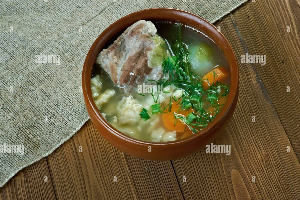 Peasant Soup Recipe: Authentic Belizean Comfort Food Guide 2 A large pot of hearty Belizean peasant soup filled with chunks of root vegetables, beans, and aromatics.