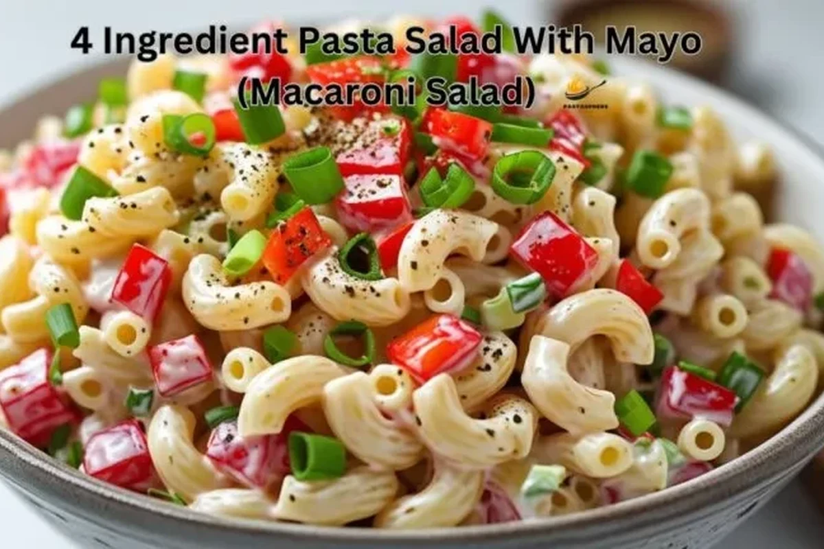4 Ingredient Pasta Salad with Mayo 1 A bowl of creamy rotini pasta salad with mayonnaise and fresh vegetables.
