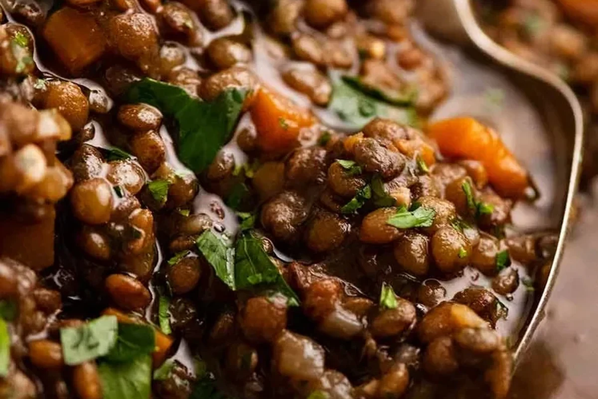 Lentils Taste 2 A variety of colorful dried lentils including brown, green, and red arranged in bowls.