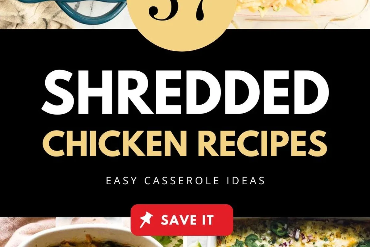 A bowl of freshly shredded, juicy cooked chicken with fresh herbs on a wooden kitchen surface.