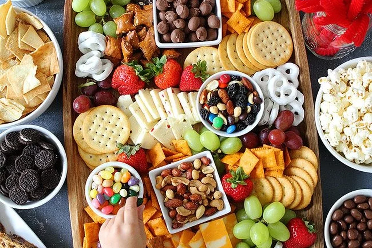 Assorted Belizean-style fun snacks with sweet and savory bite-sized treats on a serving tray