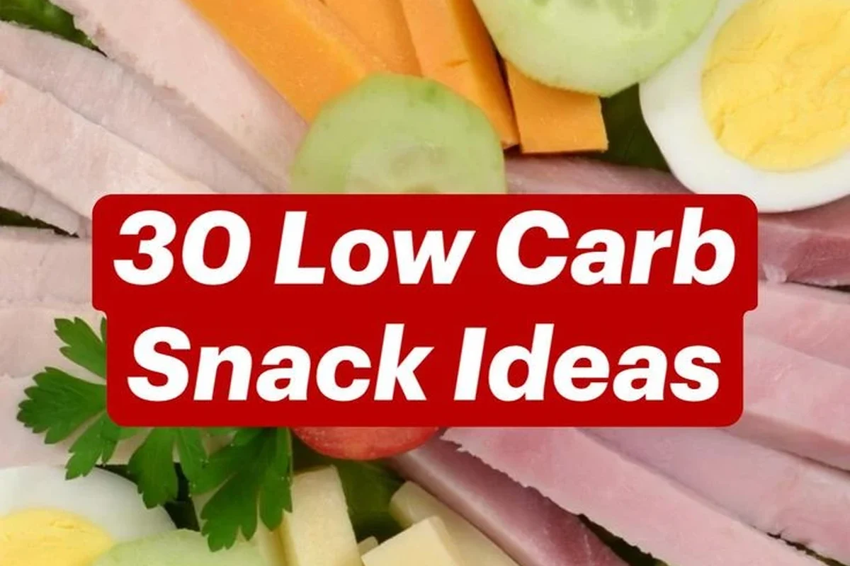 Assorted low-carb Belizean snack plate with eggs, cucumber, avocado, cheese, and herbs